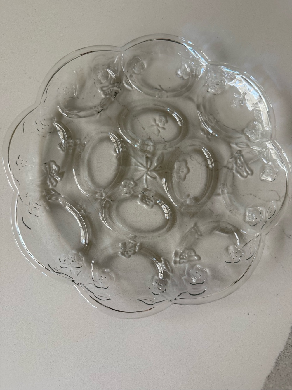 Anchor Hocking Savannah clear glass deviled egg tray featuring a scalloped edge